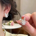 Delicate Silver Tone Bow Stud Earrings with Clear Crystals view 1