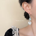 Silver Tone Huggie Hoop Blue Stone And Translucent Disc Earrings view 2