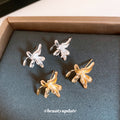 Sculptural Lily Flower Metal Stud Earrings With Decorative Metal Accents view 3