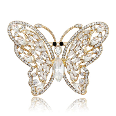 A wide butterfly outlined with clear crystals and colored body stones shown on a white background