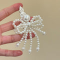 White Pearl Beaded Bow Duckbill Hair Clip Silver Ornate Top view 4