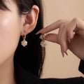 White Bead Floral Gold Tone Delicate Small Huggie Earrings view 1