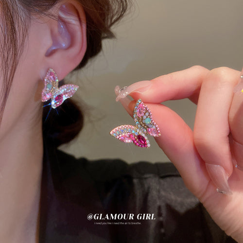 Pink Iridescent Crystal Butterfly Statement Stud Earrings shown in arranged product view