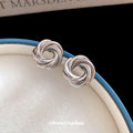 Sculptural Knot Stud Earrings In Gold And Silver Tones view 4