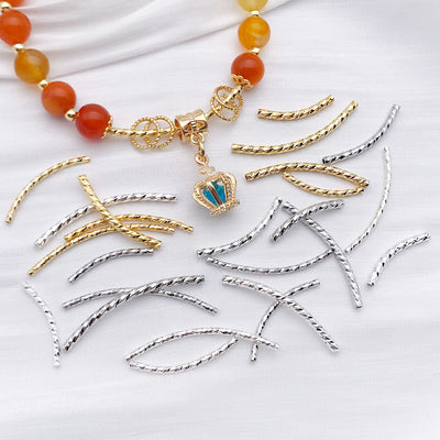Curved faceted metal tube beads in eight sizes arranged as a full product overview