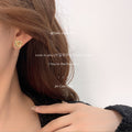 Triple Loop Knot Stud Earrings In Polished Silver And Gold Tone view 2