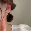 Polished Oval Dome Stud Earrings in Gold and Silver Tones view 2