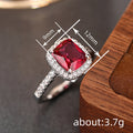 Deep Red Cushion Solitaire Halo Pave Ring In Silver Tone view 4