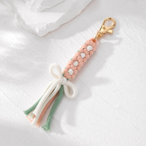 Close-up showing the colors and surface details of gold Tone Woven Daisy Bow Tassel Clip Keychains in Four Colors