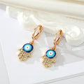 Gold Tone Crystal Hamsa Evil Eye Necklace and Huggie Earrings view 7