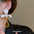 White Enamel Flower Stud Earrings With Yellow Drops view 3
