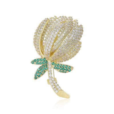 Gold clear rhinestone rose bud brooch with green leaves
