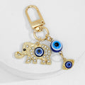 Gold Tone Evil Eye Charm Keychain With Hamsa Hand Accent view 2