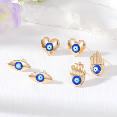 Main product view of gold Tone Hamsa Heart and Eye Stud Earrings in Three Designs