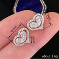 Silver Tone Heart Stud Earrings Open Center Clear Stones view 4