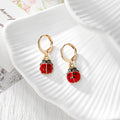 Gold Tone Red Ladybug Huggie Earrings in Six Designs view 7