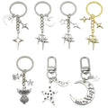 Celestial Charm Keychains Featuring Gold-Tone Stars Across 15 Pictured Variations view 5