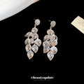 Silver Filigree Leaf Chandelier Earrings with Reflective Details view 3