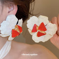 White Petal Enamel Flower Stud Earrings with Polished Metal Tone Details view 3