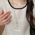 Silver Fish Pendant Necklace with Blue Accent Stone view 1