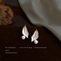 Gold Tone White Leaf And Pearl Accent Stud Earrings For Women view 3
