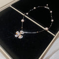Butterfly and Pearl Station Necklace in Silver and Gold view 6