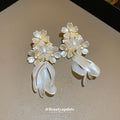 White Floral Pearl Stud and Hoop Earrings in Fourteen Styles view 4