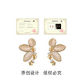 Gold Butterfly Stud Earrings Peach Cat Eye Star Accents view 3