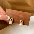 Gold Tone Pearl Drop Earrings with Textured Oval Frames view 3