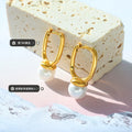 Gold Oval Huggie Hoop Earrings White Glass Pearl Drop view 2