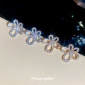 Crystal Outline Flower Stud Earrings in Silver and Gold view 3