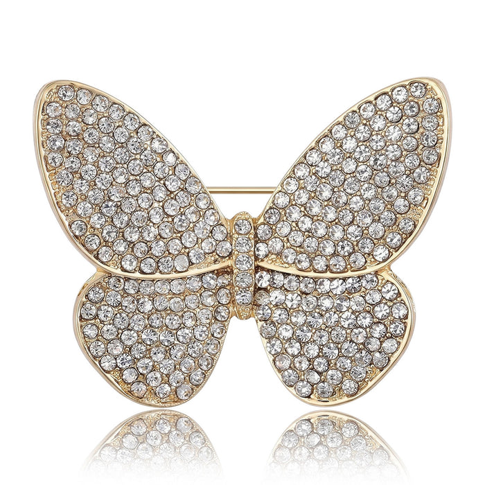 Pavé Crystal Butterfly Brooch With Polished Metal And Sculpted Decorative Details