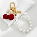 Red Cherry Charm Bag Keychain with Gold-Tone Hardware view 4