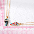 Gold Tone Slipper Evil Eye Pendant Necklaces in Red and Black view 5