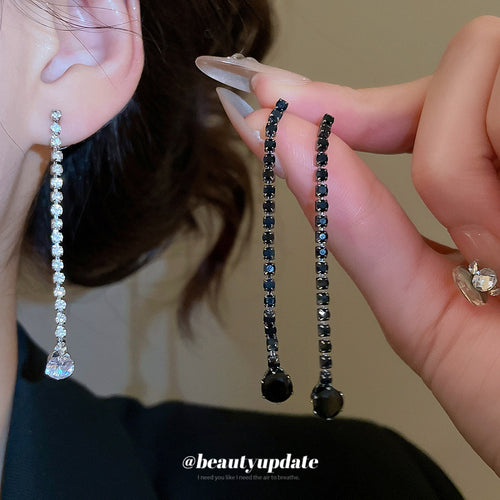 Silver and gun-black long linear rhinestone drop earrings close-up