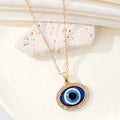 Gold Tone Oval Crystal Halo Blue Evil Eye Pendant Necklace view 3