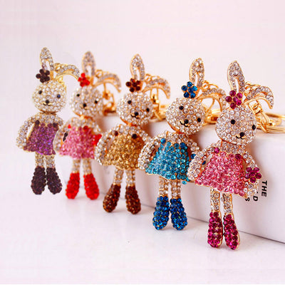 Five rhinestone rabbit keychains displayed together in assorted colors.
