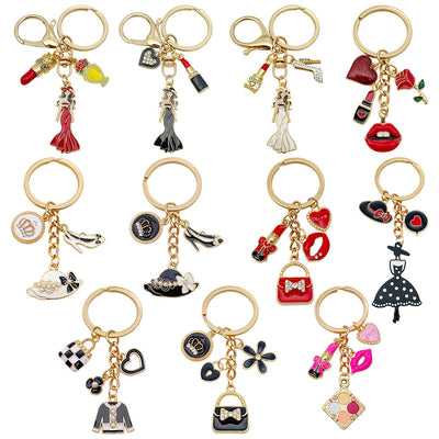Catalog view of the pictured ten fashion dress lipstick and handbag metal keychain on a light background