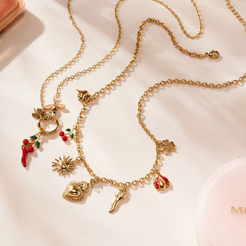 Two gold multi-charm necklaces with chili bee heart and sun charms