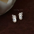 Silver Tone Bow White Potion Bottle And Blue Stone Stud Earrings view 1