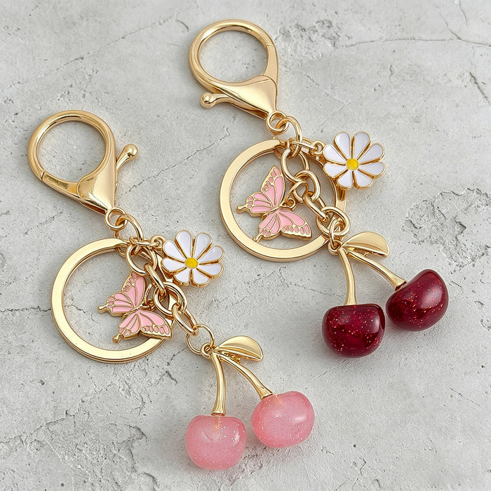 Cherry Charm Keychain with Enamel Butterfly and Daisy Flower Pendant