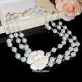 Layered Faux Pearl Necklace with White Floral Centerpiece view 2