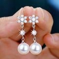 Silver Tone Snowflake White Pearl Look Drop Earrings view 1