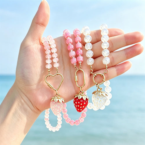 Strawberry pendant necklace shown in a styled close-up