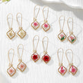 Gold Tone Quatrefoil Pressed Flower Drop Earrings in Six Designs view 1