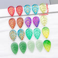 Gold Tone Edged Glass Leaf Charms in Ten Color Finishes view 1