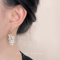 Gold Tone Long Hook And White Flower Cluster Tassel Earrings view 2