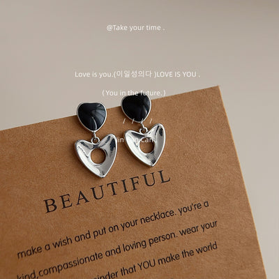 Black enamel heart drops with silver open hearts on kraft card