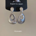 Ridged Open Teardrop Clip On Earrings in Silver with Polished Details view 3
