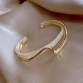 Four Gold Tone Bangle Styles With Shell Inlay And Crystal Details view 7